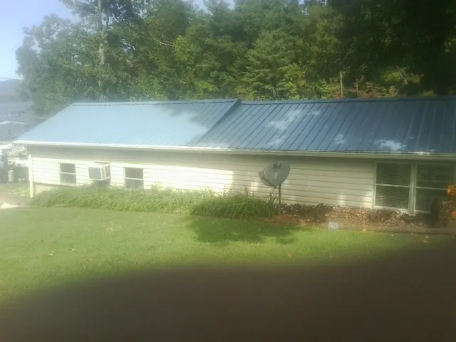 Blue metal roof running the length of a single story home in Livingston